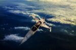 Military Jet Plane Flying Over Mountain Country View Below Stock Photo