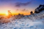 Mountaineer Stands On The Peak In Winter,deogyusan National Park In South Korea And Take Photo With Camera To Sunrise. Beautiful Moment The Miracle Of Nature Stock Photo