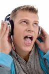 Man Listening Through Headphone Stock Photo