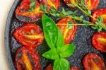 Baked Cherry Tomatoes With Basil And Thyme Stock Photo