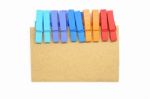 Brown Notepad With Colorful Clip On White Background Stock Photo