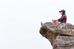 Woman On The Cliff Stock Photo