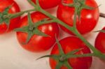 Fresh Cherry Tomatoes On A Cluster Stock Photo