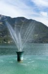 Fountain In Lake Wolfgang At St. Gilgen Stock Photo