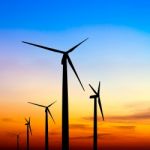 Wind Turbine Silhouette On Colorful Sunset Stock Photo