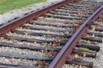 Photo Of The Rusty Railroad And Fallen Leaves Stock Photo