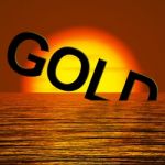 Gold Word Sinking In Sea Stock Photo