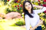 Young Beautiful Woman With Long Straight Dark Hair Posing In Spr Stock Photo