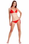 Full Length Of Stunning Woman In Red Bikini Posing Stock Photo