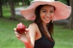 Young Woman Eating An Apple Stock Photo