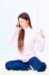 Angry Woman On Phone Stock Photo