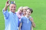 Family Capturing Their Enjoyment Stock Photo