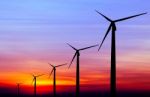 Wind Turbine Silhouette On Colorful Sunset Stock Photo