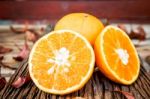 Fresh Oranges On Wooden Table Stock Photo