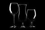 Glasses For Wine, Beer And Cocktail On Black Background Stock Photo