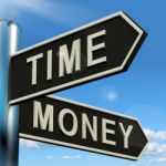 Time Or Money Signpost Stock Photo