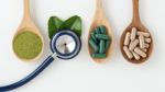 Herbal Medicine With Stethoscope On White Background Stock Photo