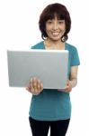 Smiling Asian Woman Holding Laptop Stock Photo