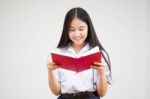 Asia Thai High School Student Uniform Beautiful Girl Read A Book Stock Photo