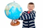 Young Boy Holding Globe Stock Photo