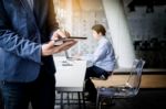 Businessman Working With Tablet In Office, Closeup Stock Photo