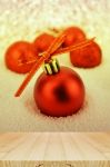 Pine Wood Table And Red Christmas Ball With Bokeh In Merry Metal Stock Photo