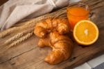 Tasty Croissant And Orange Juice Still Life Rustic Stock Photo