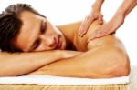 Man Having Massage In A Spa Center Stock Photo