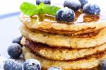 Pile Of Pancakes With Blueberries Sprinkled With Icing Sugar And Stock Photo