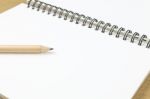 Pencil And Blank Opened Notebook Stock Photo