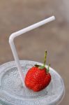 White Drinking Straw And Strawberry Stock Photo