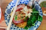 Egg Noodles With Roasted Red Pork With Crab Meat And Pak Choy. Famous Local Thai Stlye Street Food Stock Photo