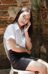 Portrait Of Thai Adult Student University Beautiful Girl Using Her Smart Phone Stock Photo