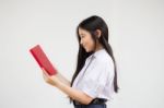 Asia Thai High School Student Uniform Beautiful Girl Read A Book Stock Photo