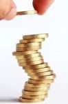 Hand Stacked Gold Coins Stock Photo