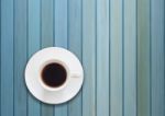 Top View Of Cup On Blue Wooden Background Stock Photo