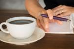 Hot Cup Of Coffee On Working Table Stock Photo