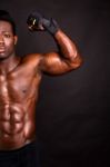 Muscular Man Flexing His Biceps Stock Photo