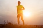 Handsome Young Man Running In The Park Stock Photo