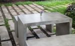 Concrete Outdoor Furniture Set In The Small Garden Stock Photo