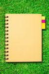 Notebook On Grass Stock Photo