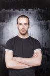 Young Male With Crossed Arms Stock Photo