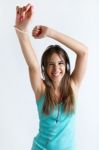 Beautiful Girl Dancing And Listening To Music. Isolated On White Stock Photo