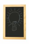 Bulb On Blackboard Stock Photo