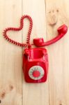 Red Landline Which Cable Has Heart Shape On Wooden Background Stock Photo