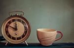 Watch And Cup On  Vintage Background Stock Photo