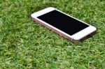 Smartphone On Grass Background Stock Photo