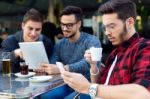 Outdoor Portrait Of Young Entrepreneurs Working At Coffee Bar Stock Photo