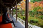 Woman In Enkoji Temple Enjoys Autumn Colorful Japanese Garden Stock Photo