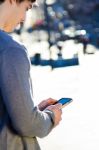 Young Man Chatting With Their Smartphone Stock Photo